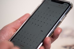 Close up image of a mobile phone with the calendar open