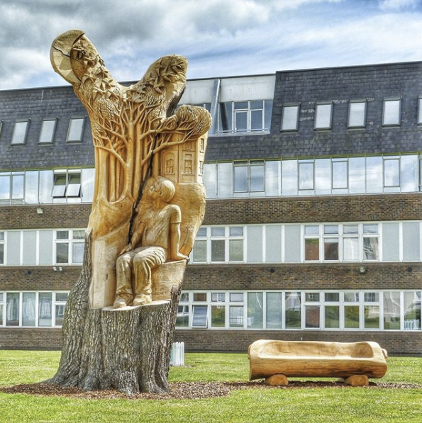 OU tree with artists carving