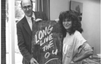 Dame Julie Walters with 'long live the OU' on a sign