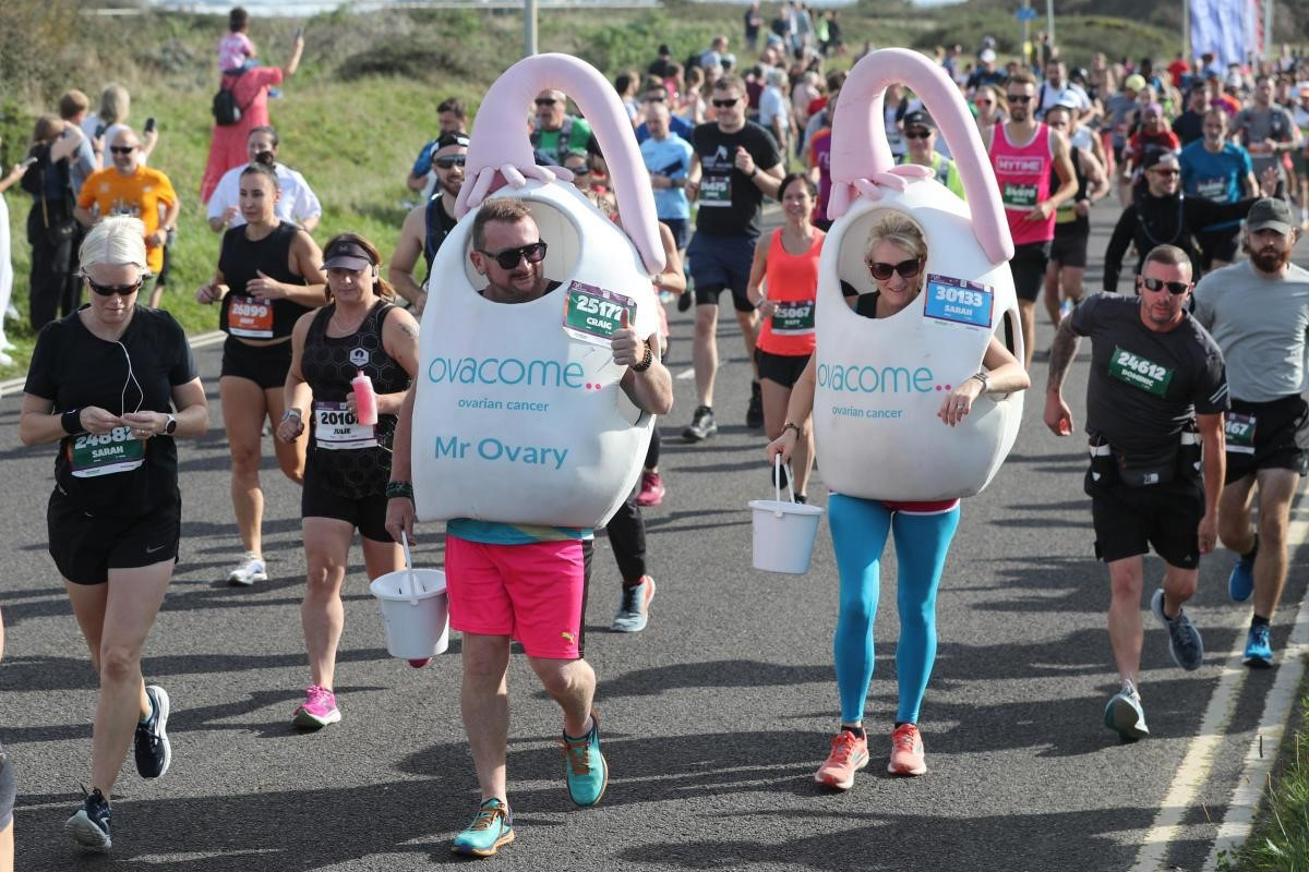 Craig and his friend Sarah, Mr and Ms Ovary, dressed in ovary costumes at a running event.