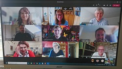 Image of new PhD students smiling during an online meeting