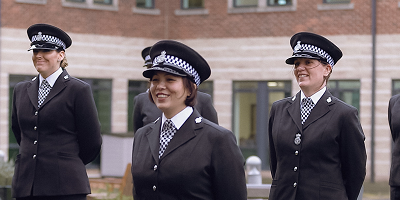 Policing graduates standing on ceremony