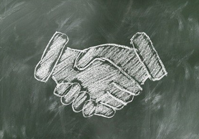 chalkboard illustration of two hands shaking