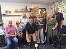 Nick is shown with some of the members and trustees of StrokeInformation, together with support dog Misty the Alsatian