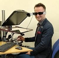 Image of James with the early hapTEL dental simulators at King’s College London