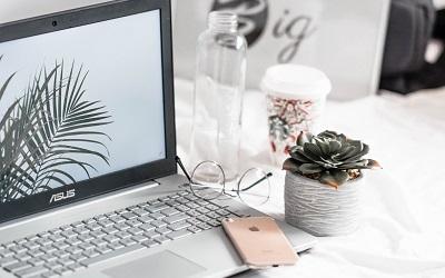 Photo by Aleksander Vlad on Unsplash - laptop and iPhone