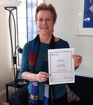 Jean Hartley with award