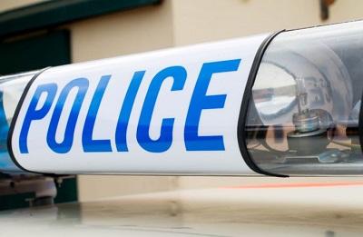 Image of police light on top of police car